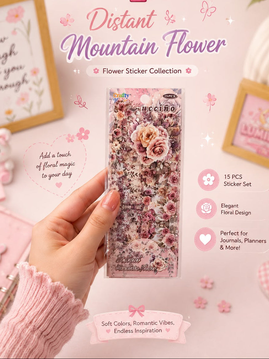 A hand holds a clear plastic package of 'Distant Mountain Flower' flower stickers. The package contains 15 pink and purple-toned flower stickers.